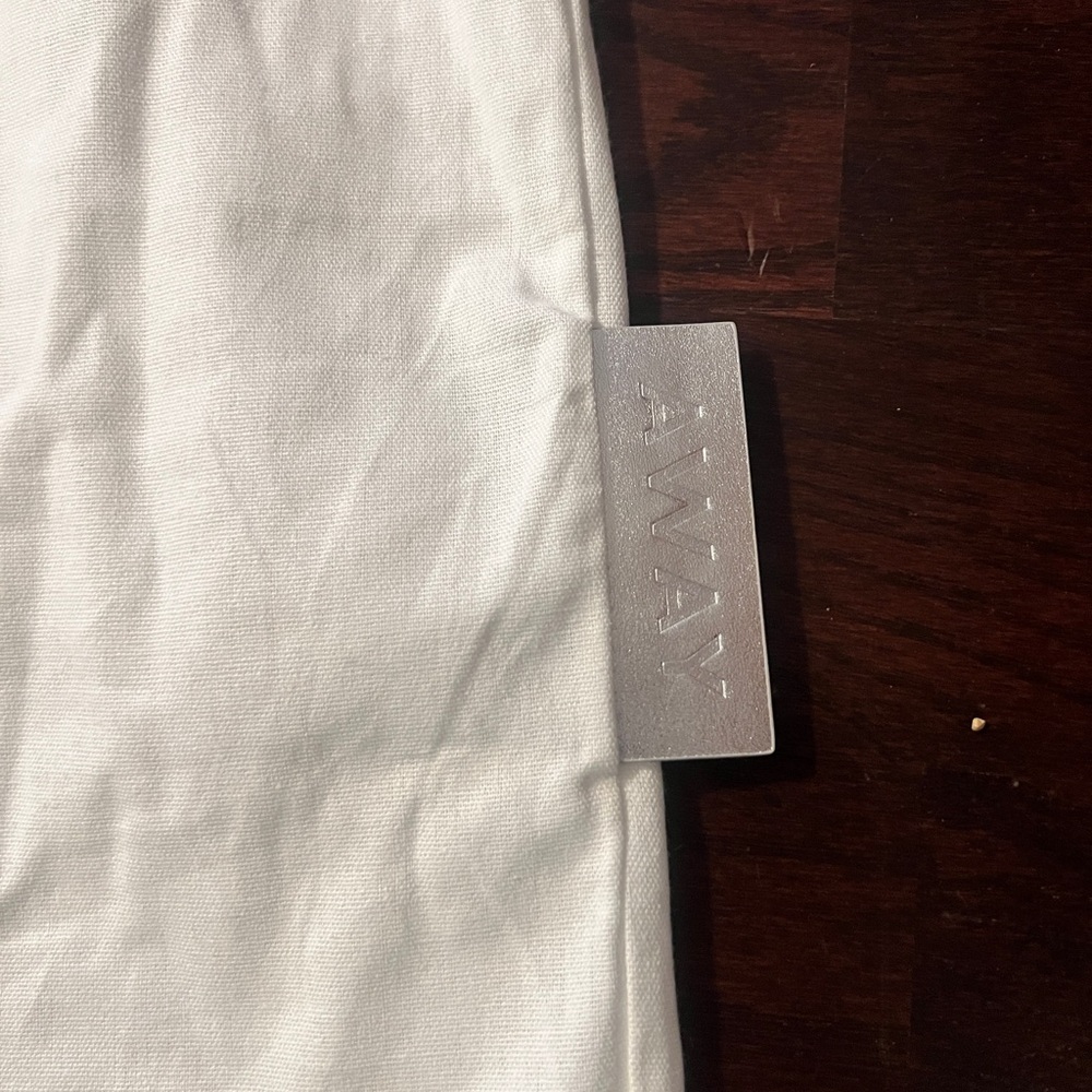 Away aluminum Dust Bag for carryon. Clean & New. Only a hand tag as shown.
